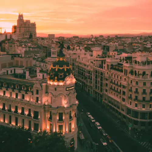 Image showing sunset over Madrid, Spain featuring the Metropolis Building